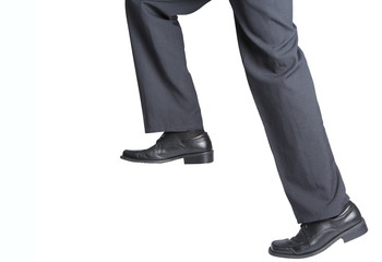 striding legs in suit pants