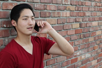 Image of young male using cellular phone