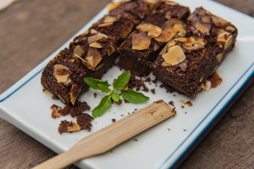 Delicious cake chocolate walnut brownies on wooden desk