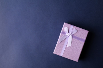 Purple present box on blue background