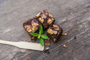 Delicious cake chocolate walnut brownies on wooden desk