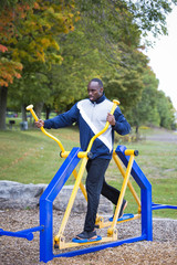 young man working out at outdoor gym