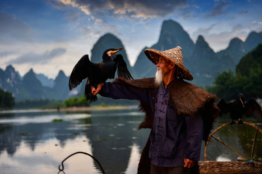Fisherman of Guilin, Li River and Karst mountains during the blue hour of dawn,Guangxi  China