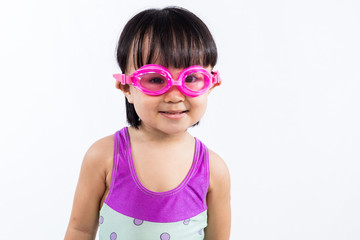 Asian Chinese little girl portrait wearing goggles and swimsuit