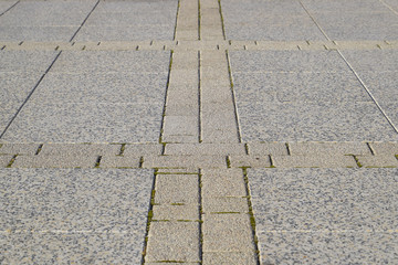 Figure out the paving slabs in the square. Background of paving slabs. Texture of stone products