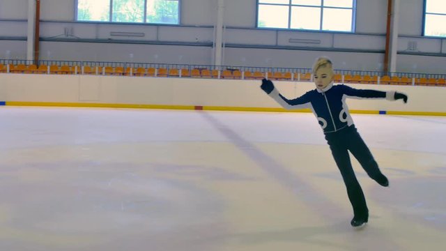 Young Figure Skater Performs a Jump