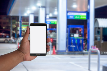 the hand of man hold mobile phone over blurred car .filling stat