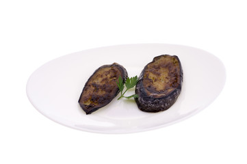 Eggplant roasted on a white plate isolated on white background