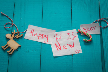 happy new year inscription on wooden background