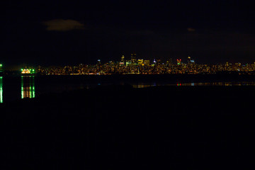Vancouver at night from spanish banks wide.