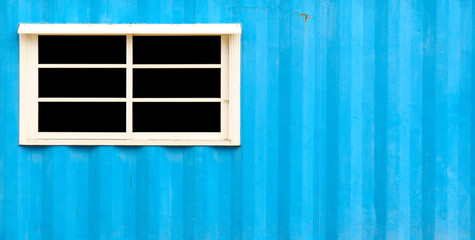 White window and zinc blue walls
