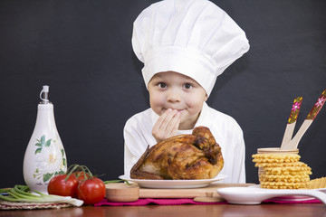 boy chef prepares grilled chicken