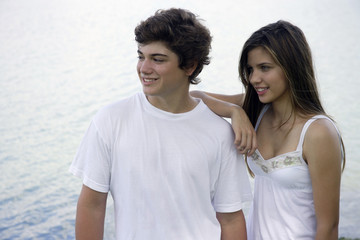 Teen couple by lake