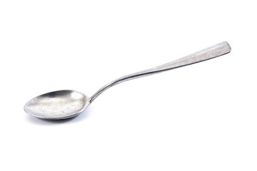 Silver tea spoon.Old aluminium tea spoon isolated on white backg
