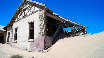 Kolmanskop ghost town sinking in sand sea, Namibia