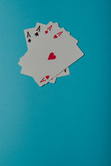 A winning poker hand of four aces playing cards