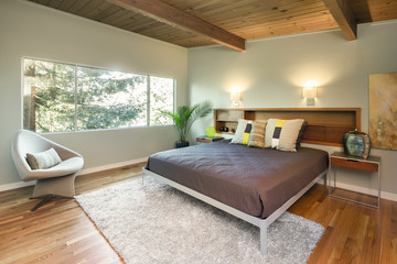 Mid Century Modern bedroom with wooden roof and wooden floor.