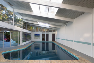 Indoor pool with tilted roof.
