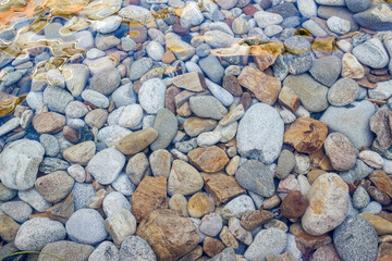 pebbles under the transparent water