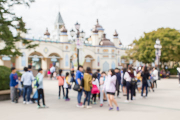 blurred people at the theme park © naiyanab