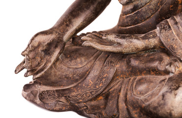 Buddha's hands in a blessing pose - varada mudra. The old statue made of metal isolated on a white background.