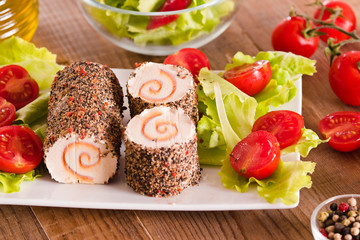 Goat cheese with salad and cherry tomatoes. 
