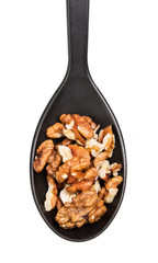 Peeled walnuts in spoon isolated on white background.
