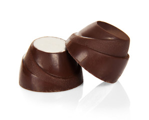 Chocolate brown candy with filling isolated on white background.