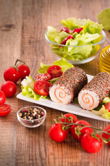 Goat cheese with salad and cherry tomatoes. 