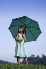 young girl with bright green umbrella