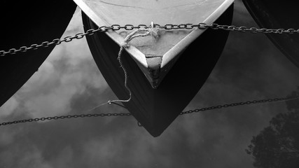 A boat for hire is chained to prevent theft. The Yarra, Melbourne, Australia.