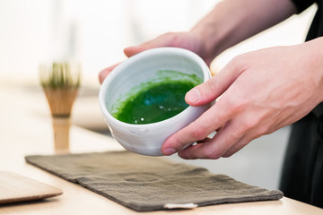 Matcha tea prepared with bamboo whisk
