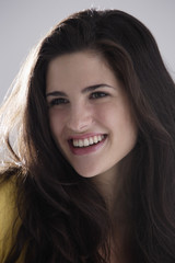 Fototapeta premium Portrait of laughing brunette woman