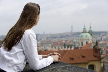 Fototapeta na wymiar young woman looking at view of Prague
