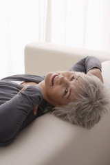 Obraz na płótnie Canvas Older woman relaxing at home.