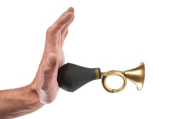 hand holds an old car horn