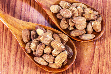 Almonds on  wooden background