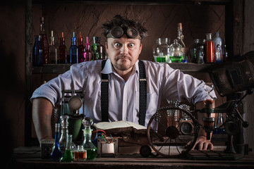 crazy medieval scientist working in his laboratory