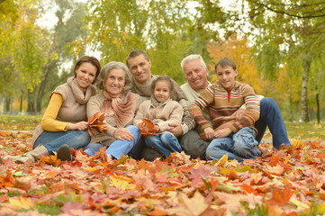 Fototapeta premium Happy family in autumn forest