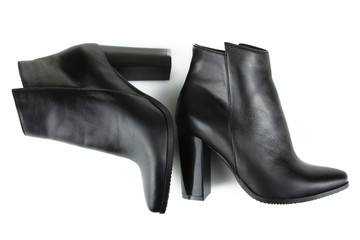 Female black boots isolated on a white background. Top view