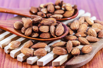 Almonds on  wooden background