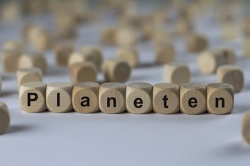 Fototapeta premium Planeten - Holzwürfel mit Buchstaben