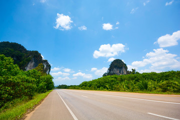 HIGHWAY ROUTE AND SCENIC BESIDE IN SUNNY DAY , CLEAR BLUE SKY CLOUD BACKGROUND