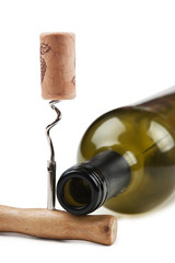 wine bottle and corkscrew isolated on white