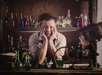 crazy medieval scientist working in his laboratory