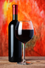 bottle and glass of red wine