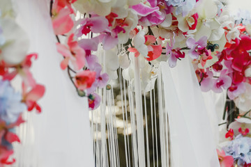 Beautiful wedding arch for marriage decorated with flowers.