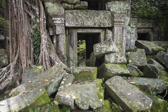Crumbling stone architecture of Ta Prohm temple at the Angkor complex in Siem Reap, Cambodia 
