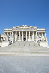 Fototapeta premium Scenic view of the United States Capitol building in Washington DC, USA from the Senate entrance staircase under clear blue sky