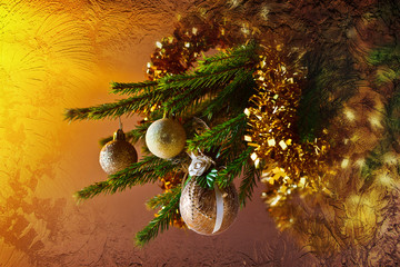 Christmas tree with decorations behind the frozen glass